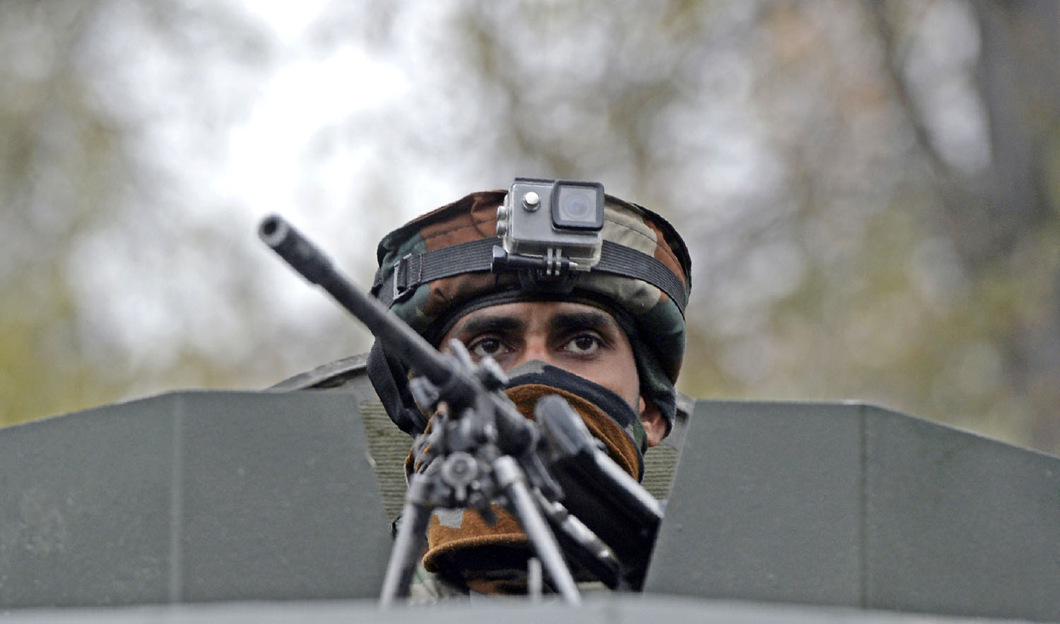 In this file photo, an Indian army soldier looks on during a cordon and search operation for suspected militants in Shuhama on the outskirts of Srinagar on Nov. 5, 2018. (AFP)