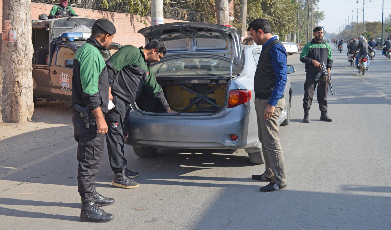 Pakistani police officers check a vehicle as security is beefed up in the eastern city of Faisalabad, Pakistan, Tuesday, Jan. 15, 2019. (AFP)