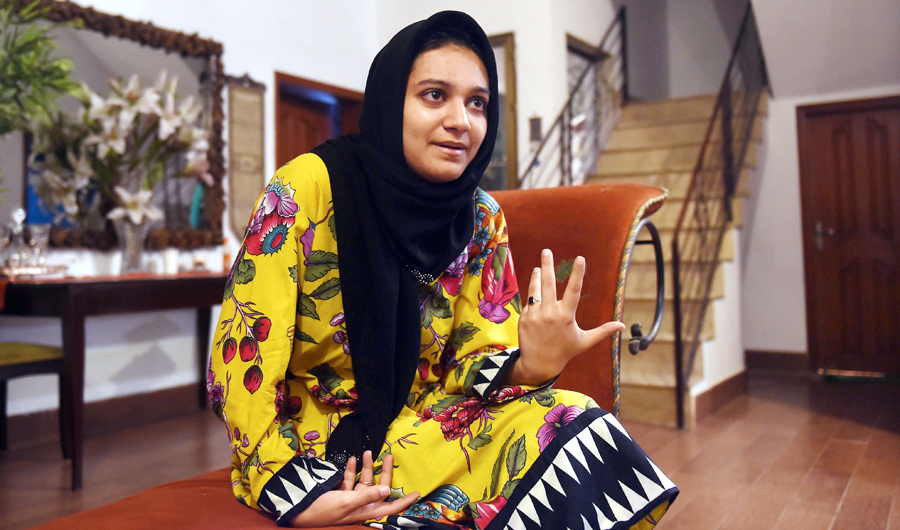 In this file photo, Khadeeja Siddiqui, 23, a Pakistani law student who was stabbed 23 times by a classmate after she had rejected him romantically, speaks during an interview with AFP in Lahore. (AFP)