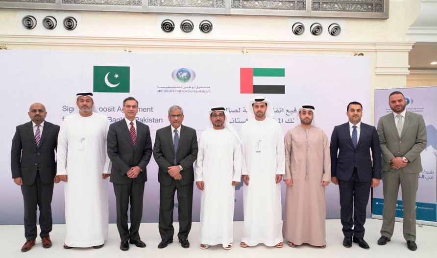 Mohammed Saif Al Suwaidi, director general of Abu Dhabi Fund for Development, and Tariq Bajwa, governor of the State Bank of Pakistan, can be seen along with officials of the two countries on Tuesday after signing an agreement in Abu Dhabi. (Photo Courtesy: UAE Embassy in Pakistan)