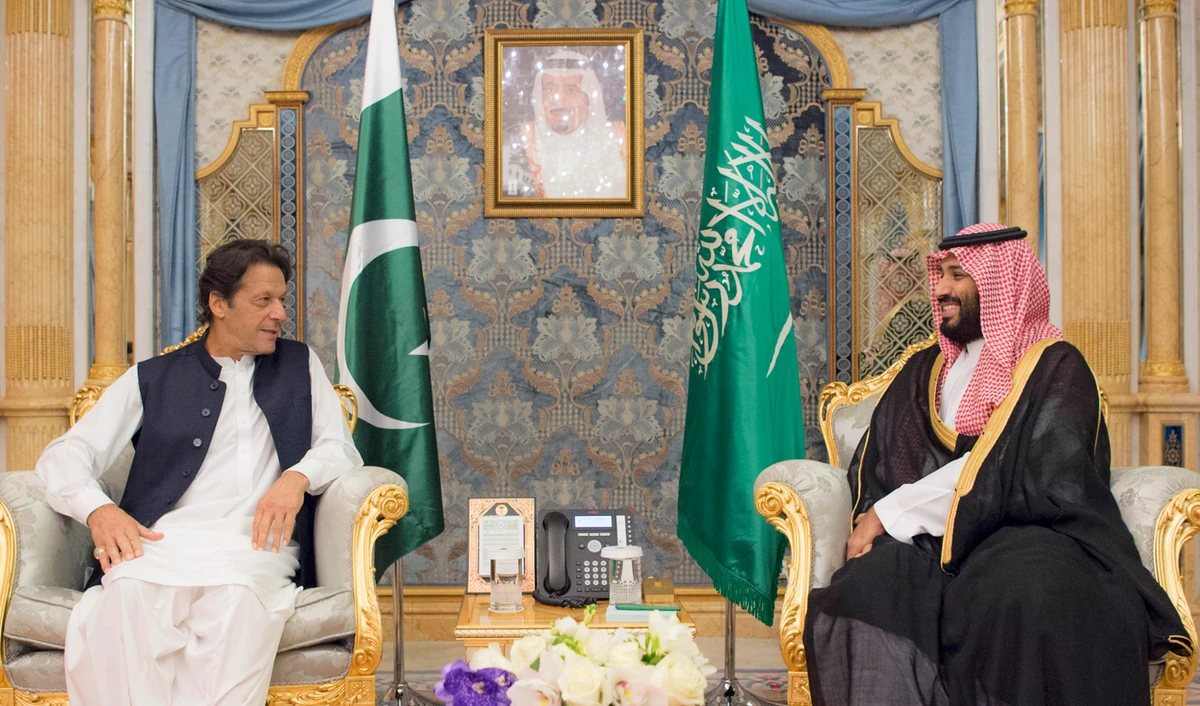 A handout image provided by the Center for International Communication (CIC), Ministry of Media, Saudi Arabia shows Crown Prince Mohammed bin Salman, right, meeting with Pakistani Prime Minister Imran Khan in Jeddah on Sept. 19, 2018. (AFP)