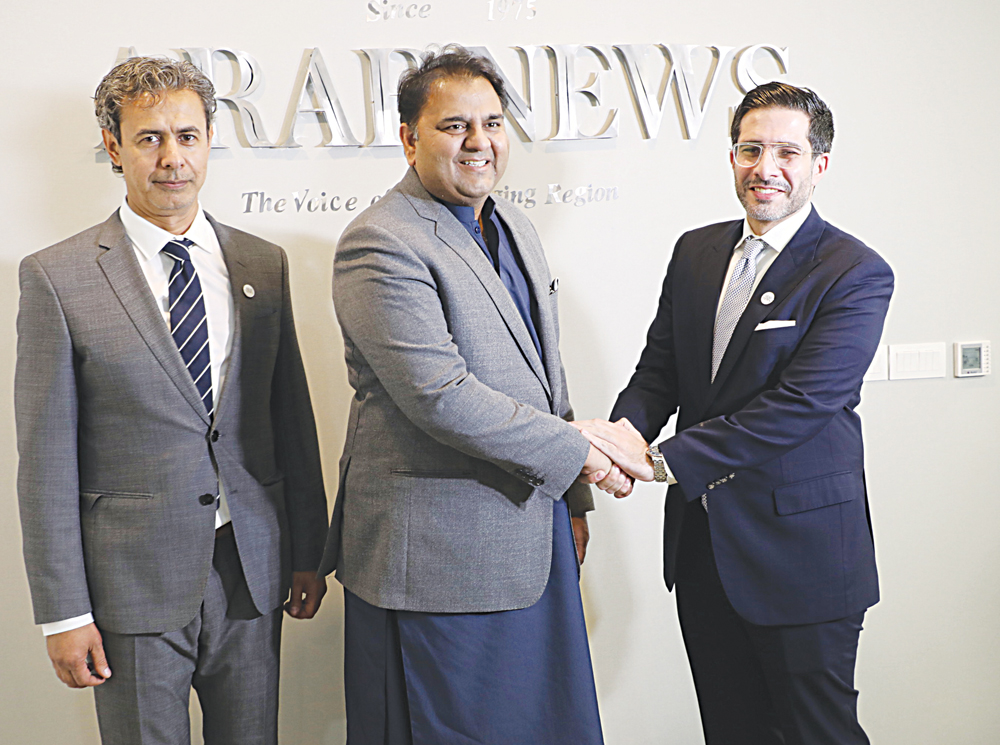 Pakistan Information Minister Fawad Chaudhry, center, with Arab News Editor-in-Chief Faisal J. Abbas, right, and Asia Bureau Chief Baker Atyani at the opening. (Arab News photo)