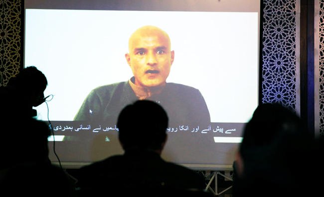 In this file photo, former Indian navy officer Kulbhushan Sudhir Jadhav is seen on a screen during a news conference at the Ministry of Foreign Affairs in Islamabad, Pakistan on Monday. (REUTERS)