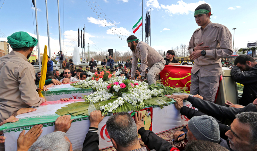 Iranian mourners surround the coffins of 27 Revolutionary Guards, who were killed in a suicide attack, during their funeral in southeastern city of Isfahan on Feb. 16, 2019. Iran's Revolutionary Guards accused "Pakistan's security forces" of supporting the perpetrators of a suicide bombing that killed 27 troops on February 13, in remarks state TV aired. (AFP)
