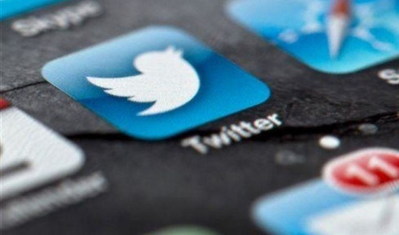 A smartphone display shows the Twitter logo in Berlin, Germany. (AP)