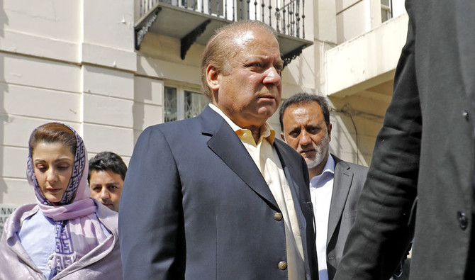 In this file photo, Pakistan's former prime minister Nawaz Sharif, center, arrives at his office in central London on July 6, 2018. (TOLGA AKMEN/AFP)