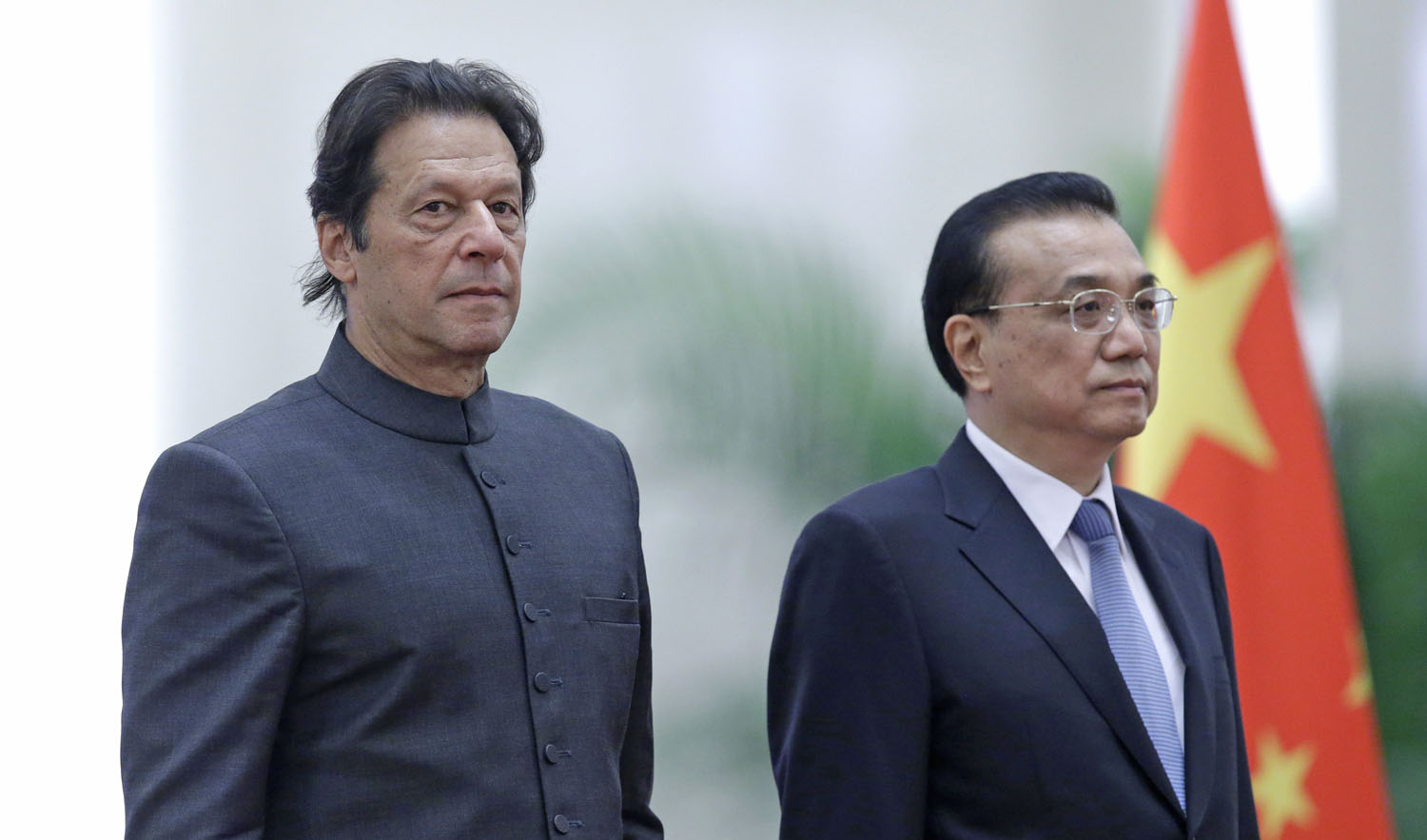 In this file photo, Pakistani Prime Minister Imran Khan, left, and China’s Premier Li Keqiang attend a welcome ceremony at the Great Hall of the People in Beijing on Nov. 3, 2018. (AFP)