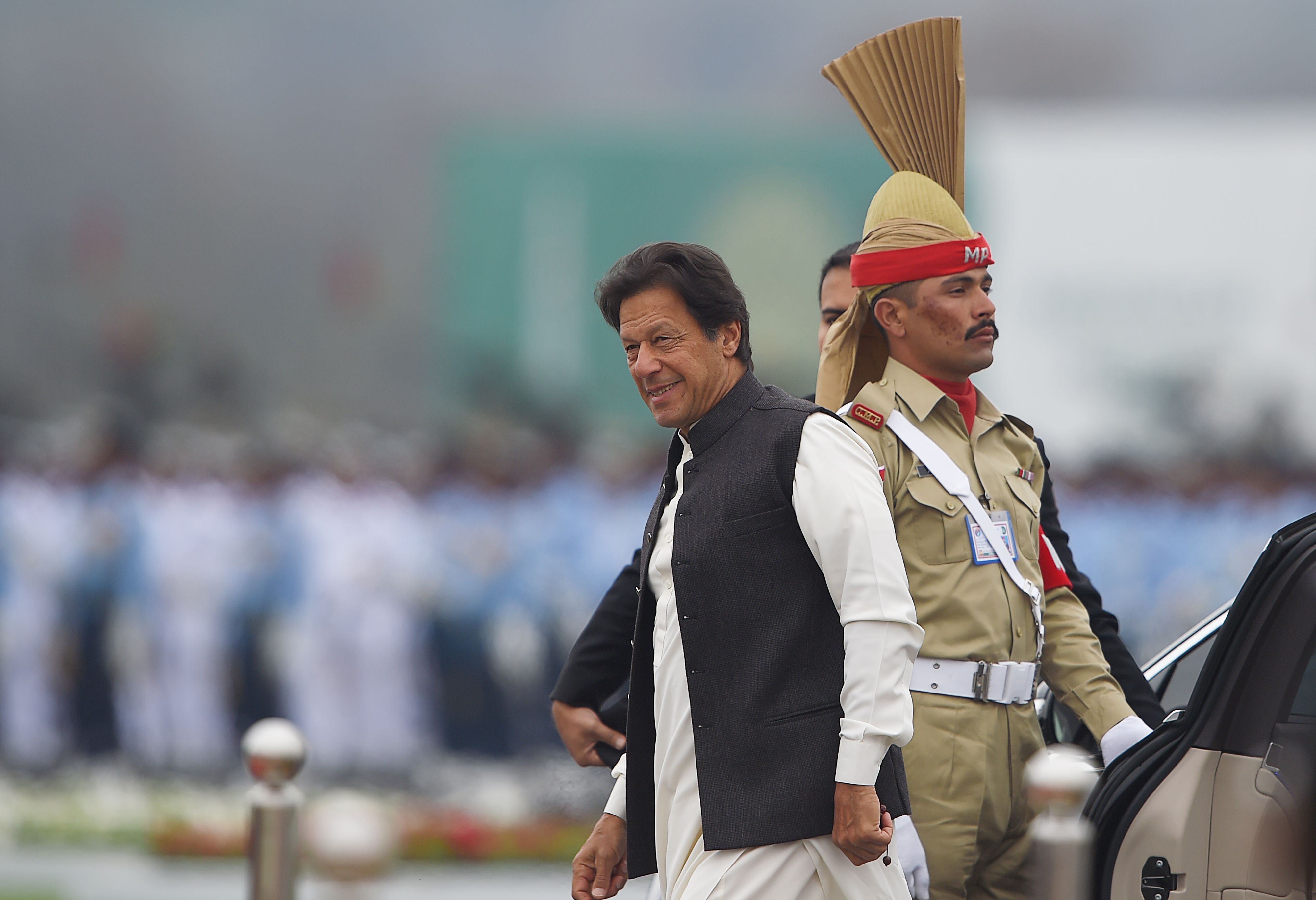 In this file photo Pakistani Prime Minister Imran Khan (C) arrives to attend the Pakistan Day parade in Islamabad on March 23, 2019. (AFP)