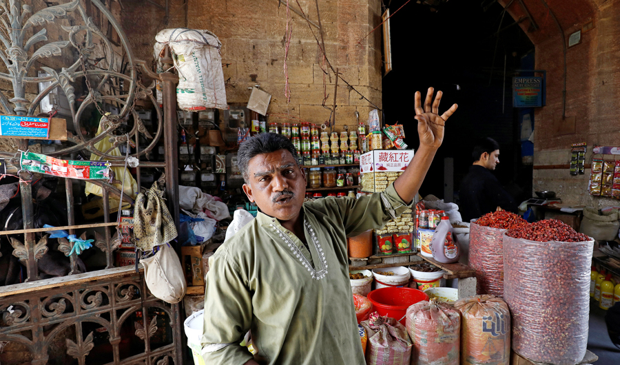 Mohammad Shakeel Abbasi, spice seller, gestures as he stands beside his makeshift stall at the British era Empress Market building after the removal of encroachments on the order of Supreme Court in Karachi, Pakistan on March 27, 2019. (Reuters)