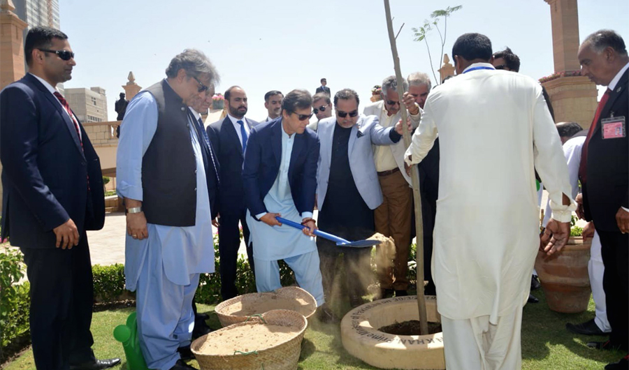 Prime Minister of Pakistan Imran Khanplanting a sapling at Bagh inb Qasim, Karachi on March 30, 2019. (PID)