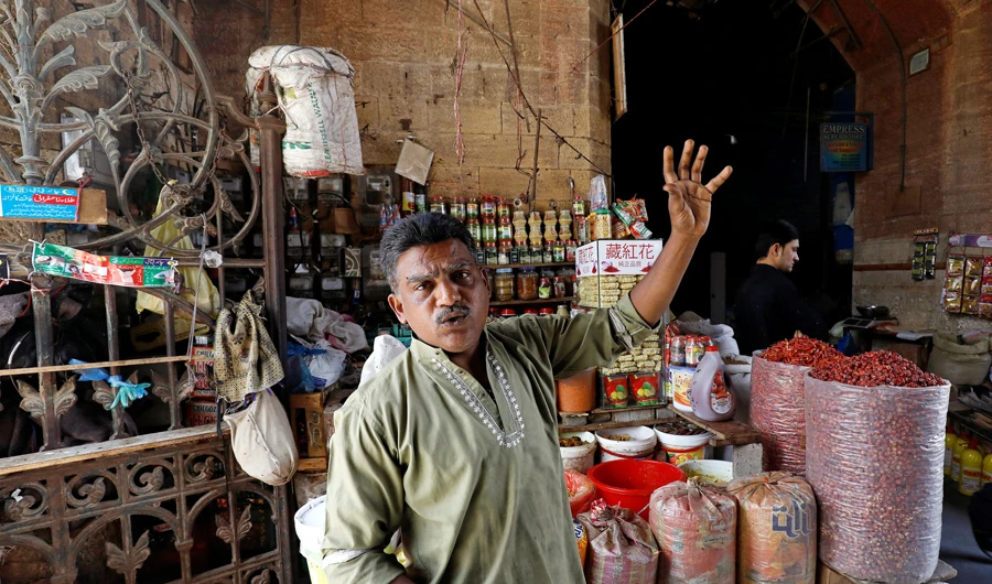 Mohammad Shakeel Abbasi, spice seller, gestures as he stands beside his makeshift stall at the British era Empress Market building after the removal of encroachments on the order of Supreme Court in Karachi, Pakistan on March 27, 2019. (Reuters)