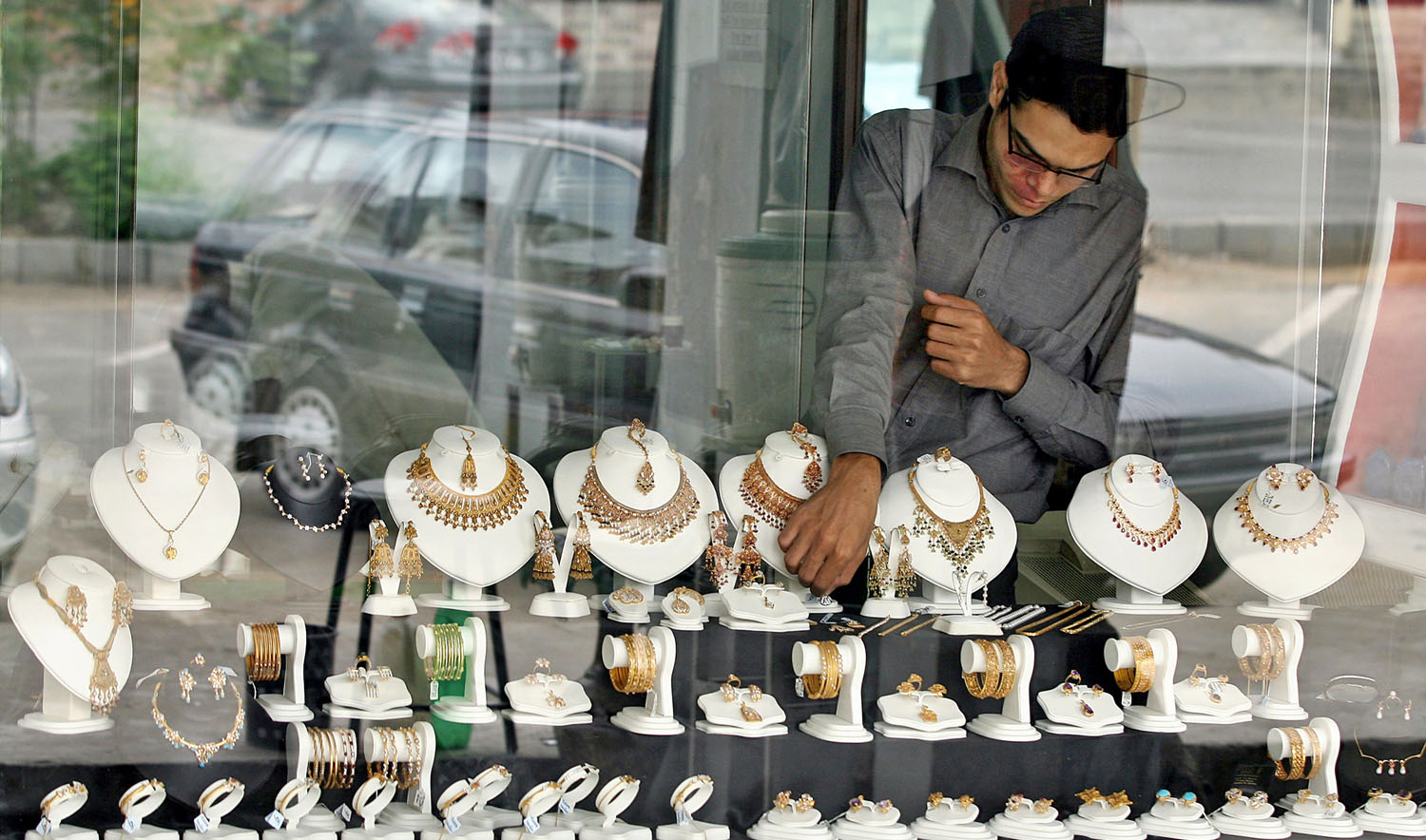 In this file photo, a Pakistani shopkeeper arranges jewelry in the window of a jewelry shop in Islamabad on July 7, 2006. (AFP)