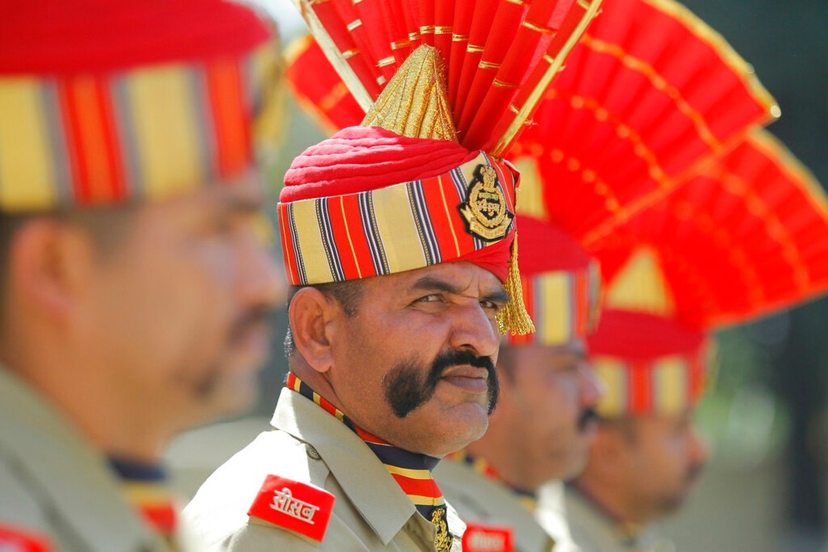 Indian Border Security Force soldiers pay tribute to to their killed colleague T. Alex Lalminlun during a wreath-laying ceremony at the BSF headquarters in Jammu, India, on Tuesday. (Channi Anand/AP)
