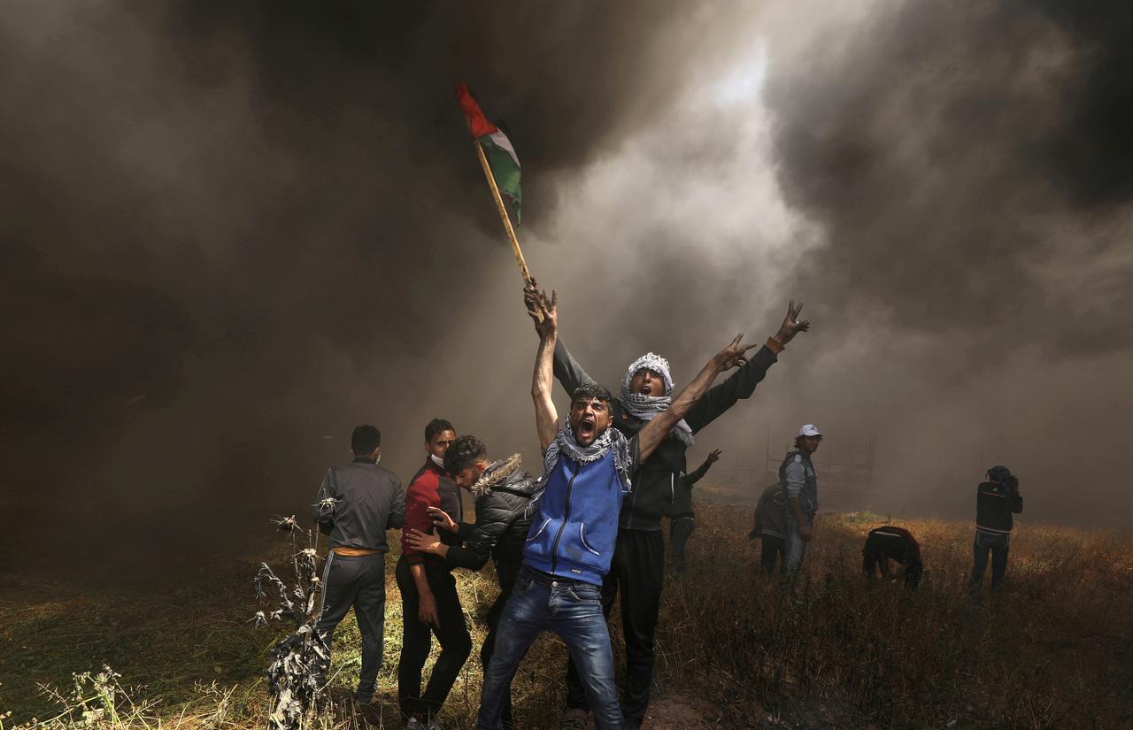In this April 6, 2018 file photo, Palestinian demonstrators shout during clashes with Israeli troops at a protest demanding the right to return to their homeland, at the Israel-Gaza border east of Gaza City. Pakistan said on Thursday it would discuss Israeli “aggression” against Palestine at the next OIC summit in Makkah. (Reuters)