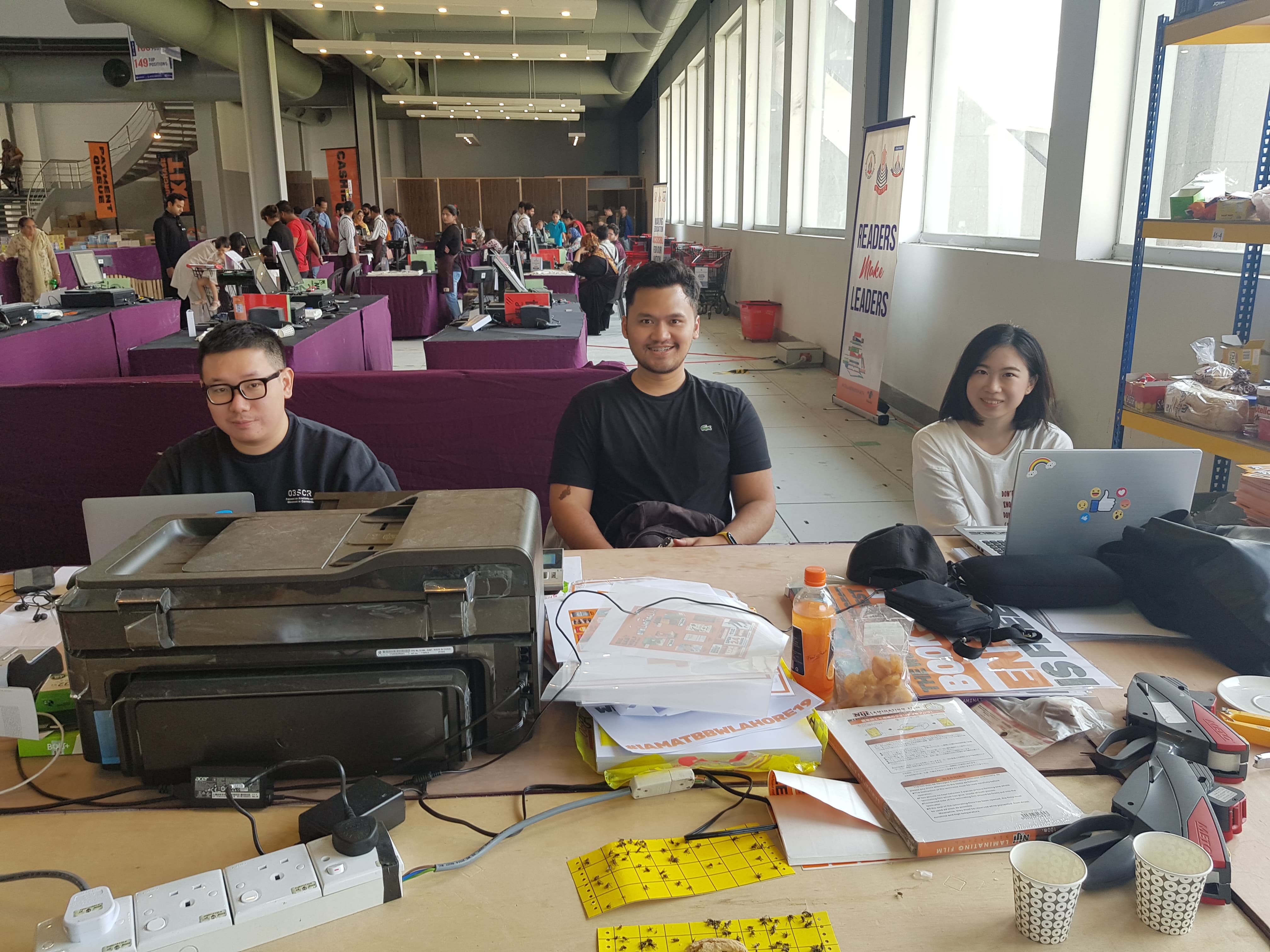 The Malaysian staff of the Big Bad Wolf Book Sale in Lahore are sitting in the administrative stall. (AN Photo)