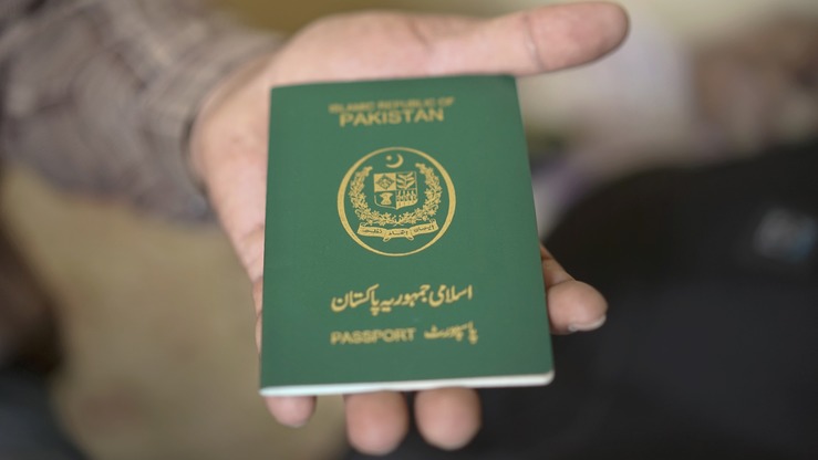 In this file photo, a man is holding a Pakistani passport. (AFP/file)