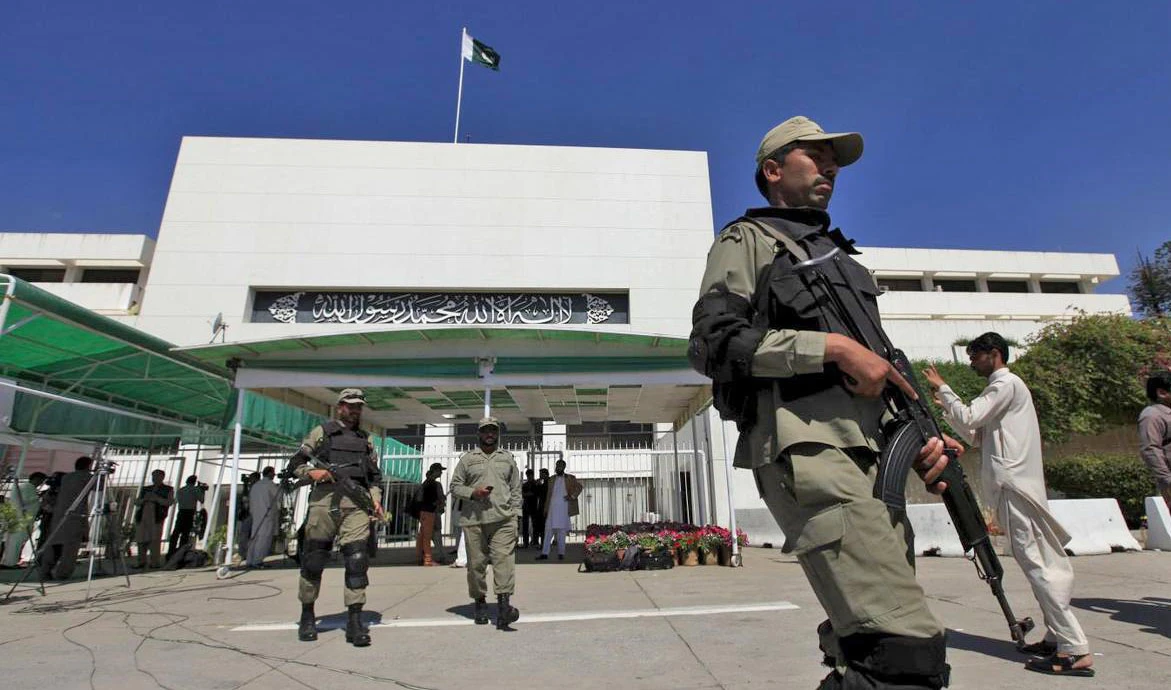 In this file photo, Paramilitary soldiers walk past the Parliament building during a joint sitting of the parliament in Islamabad April 10, 2015. (REUTERS)