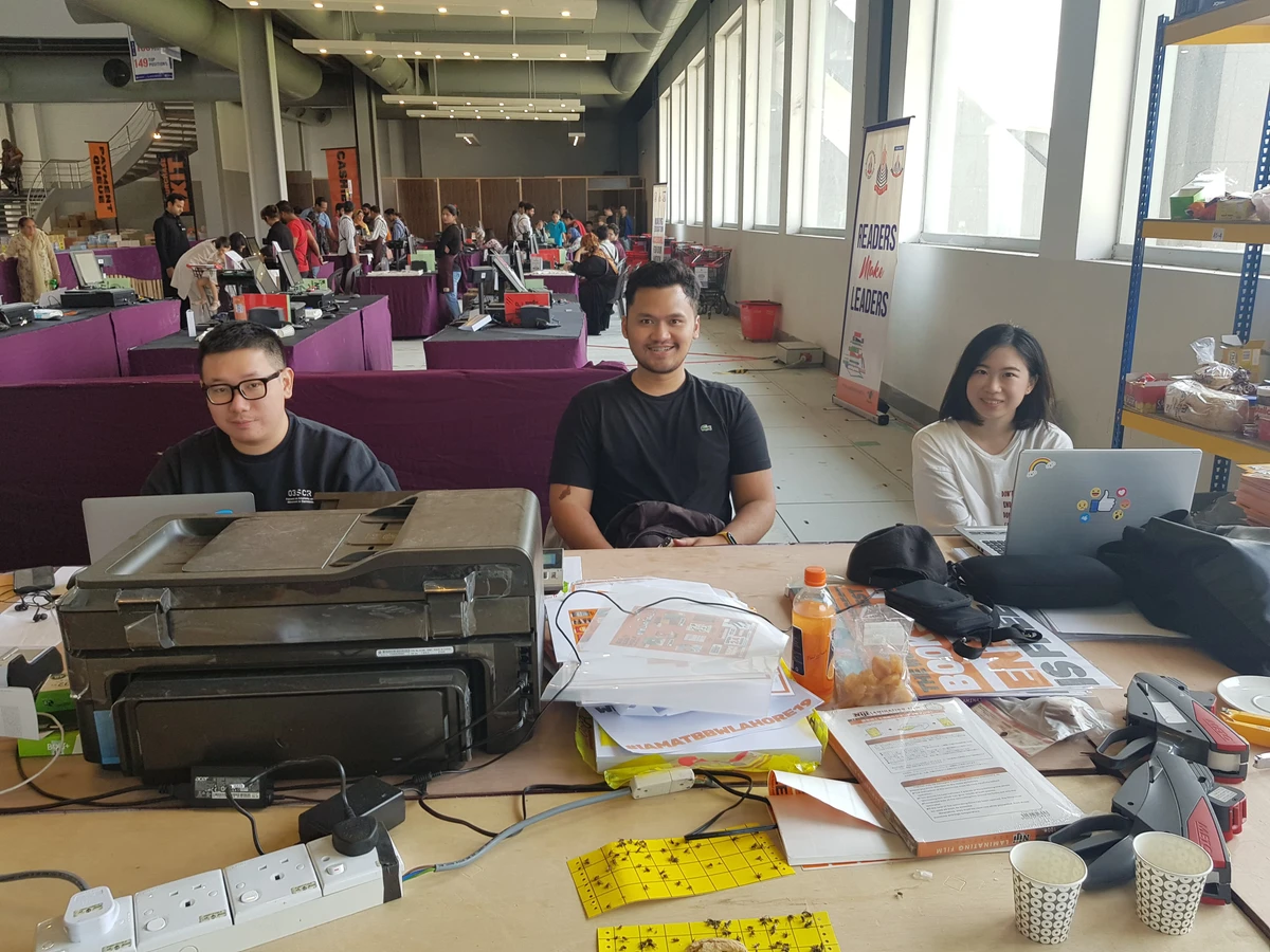 The Malaysian staff of the Big Bad Wolf Book Sale in Lahore are sitting in the administrative stall. (AN Photo)