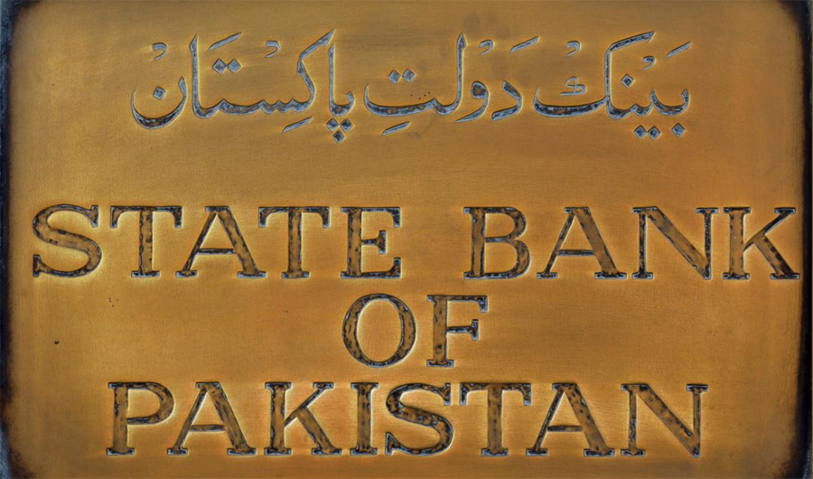 A brass plaque of the State Bank of Pakistan is seen outside of its wall in Karachi, Pakistan December 5, 2018. (Reuters/File)