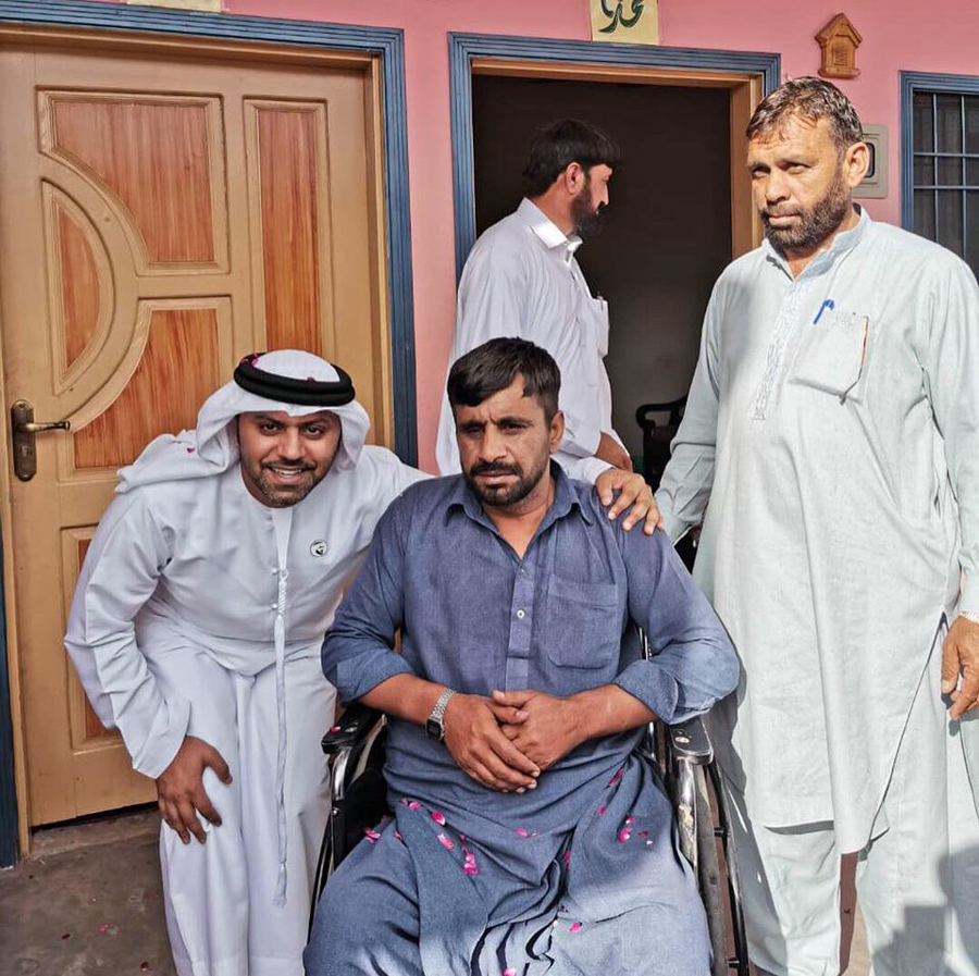 UAE ambassador to Pakistan Hamad Obaid Alzaabi hands over the ownership documents of a UAE-gifted four-room house to Ijaz Ahmed on May 2, 2019. Ahmed is a disabled person from Pakistan administered Kashmir, who lost his home in a 2005 earthquake. (Photo courtesy: UAE Embassy)