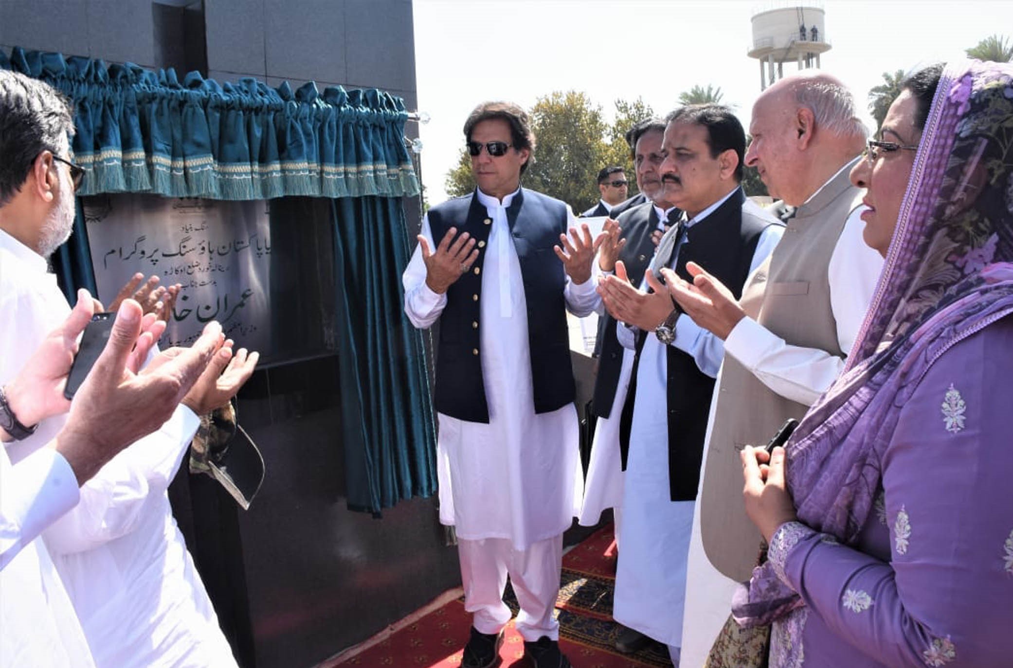 Prime Minister Imran Khan prays after inaugurating Naya Pakistan Housing Program at Renala Khurd on 4 May, 2019. (PID)