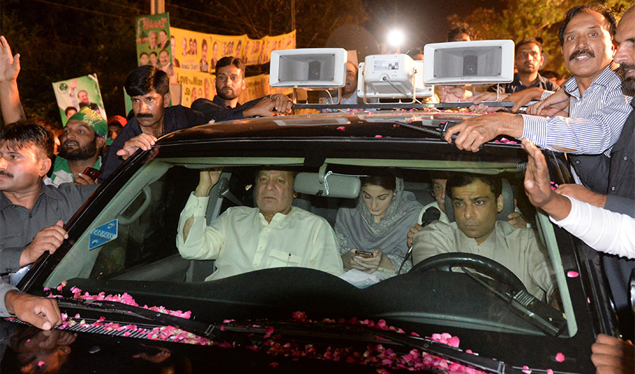 Former Pakistani Prime minister Nawaz Sharif (centre L) sits in a car as he heads back to Kot Lakpat Jail in Lahore on May 7, 2019, following the expiry of his bail. Nawaz Sharif will return to jail later on May 6 following the expiry of his six-week bail in a corruption case. (AFP)