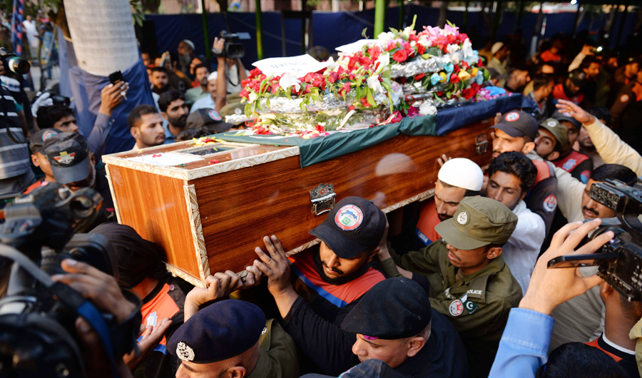 Pakistani policemen carry the coffin during the funeral of a colleague killed in a suicide blast, in Lahore on May 8, 2019. (AFP)