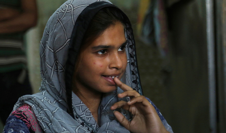 In this April 14, 2019 photo, Muqadas Ashraf speaks to The Associated Press in Gujranwala, Pakistan. Muqadas Ashraf was just 16 when her parents married her off to a Chinese man who had come to Pakistan looking for a bride. (AP Photo)
