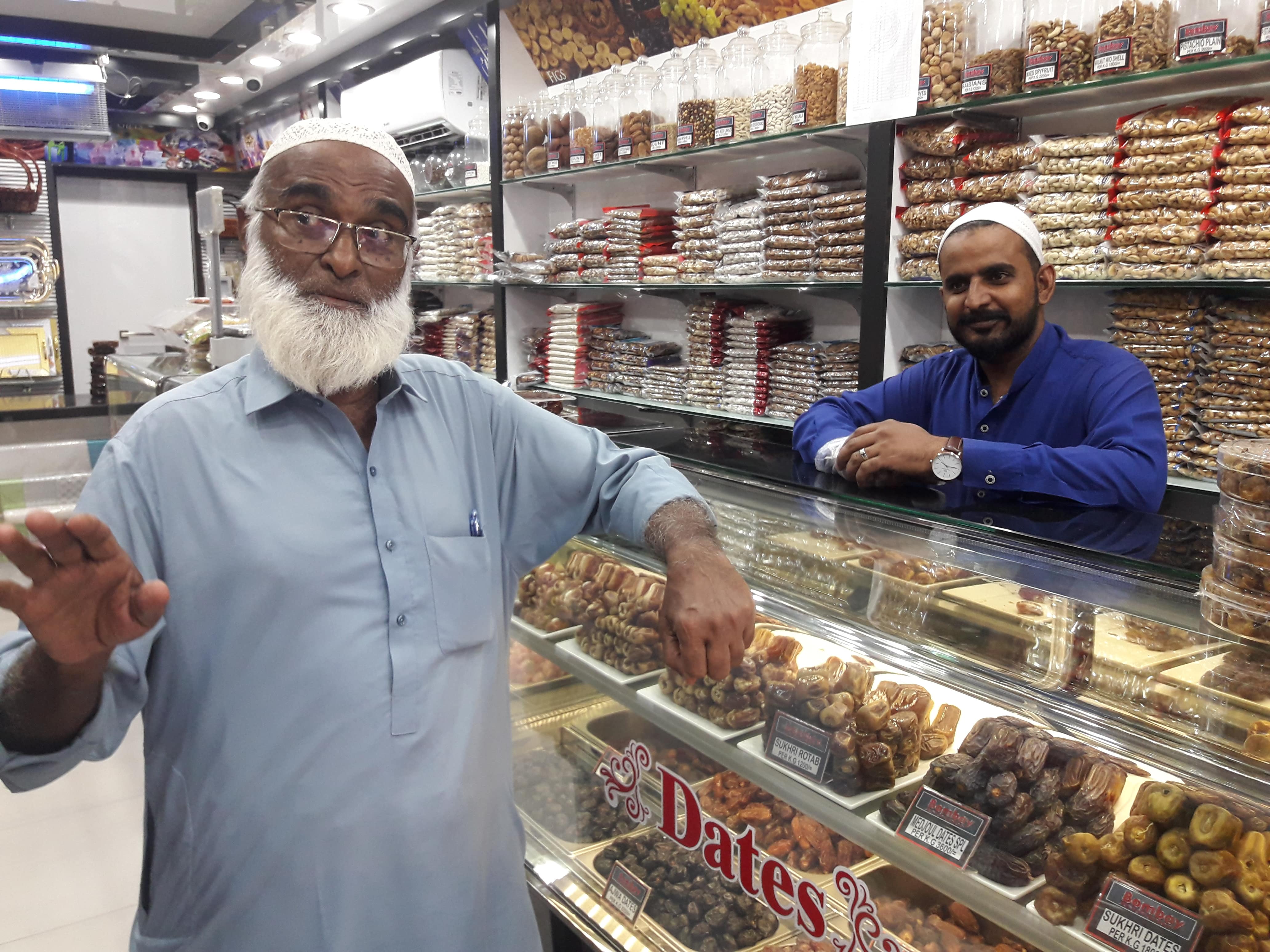 Hajji Abubaker, an importer of Saudi dates, talks about the varieties of the Kingdom’s dates at his shop in Pakistan’s Karachi city on May 8, 2019. (Photo Khurshid Ahmed)