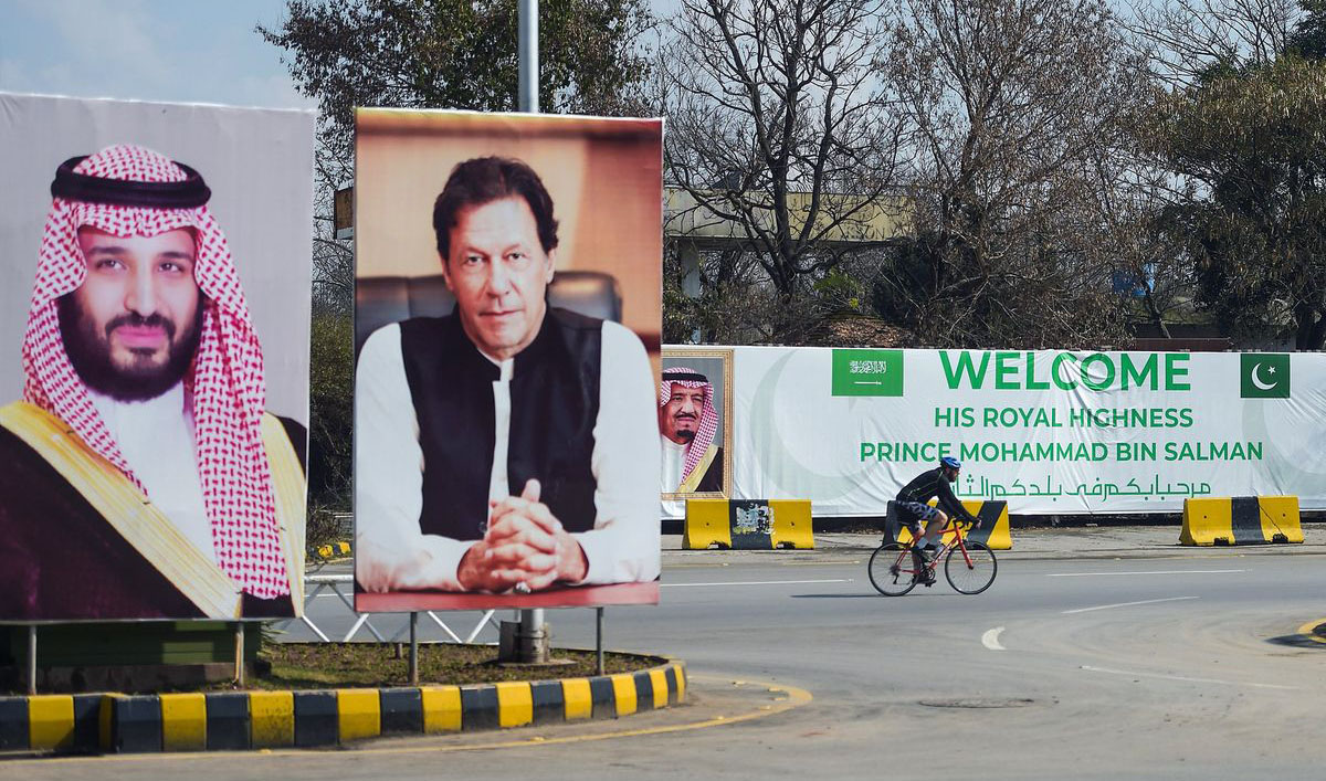 Billboards showing portraits of Saudi Arabian Crown Prince Mohammed bin Salman and Pakistan's Prime Minister Imran Khan displayed on a roadside ahead of the prince's arrival in Islamabad on Feb. 15, 2019. (AFP/File)