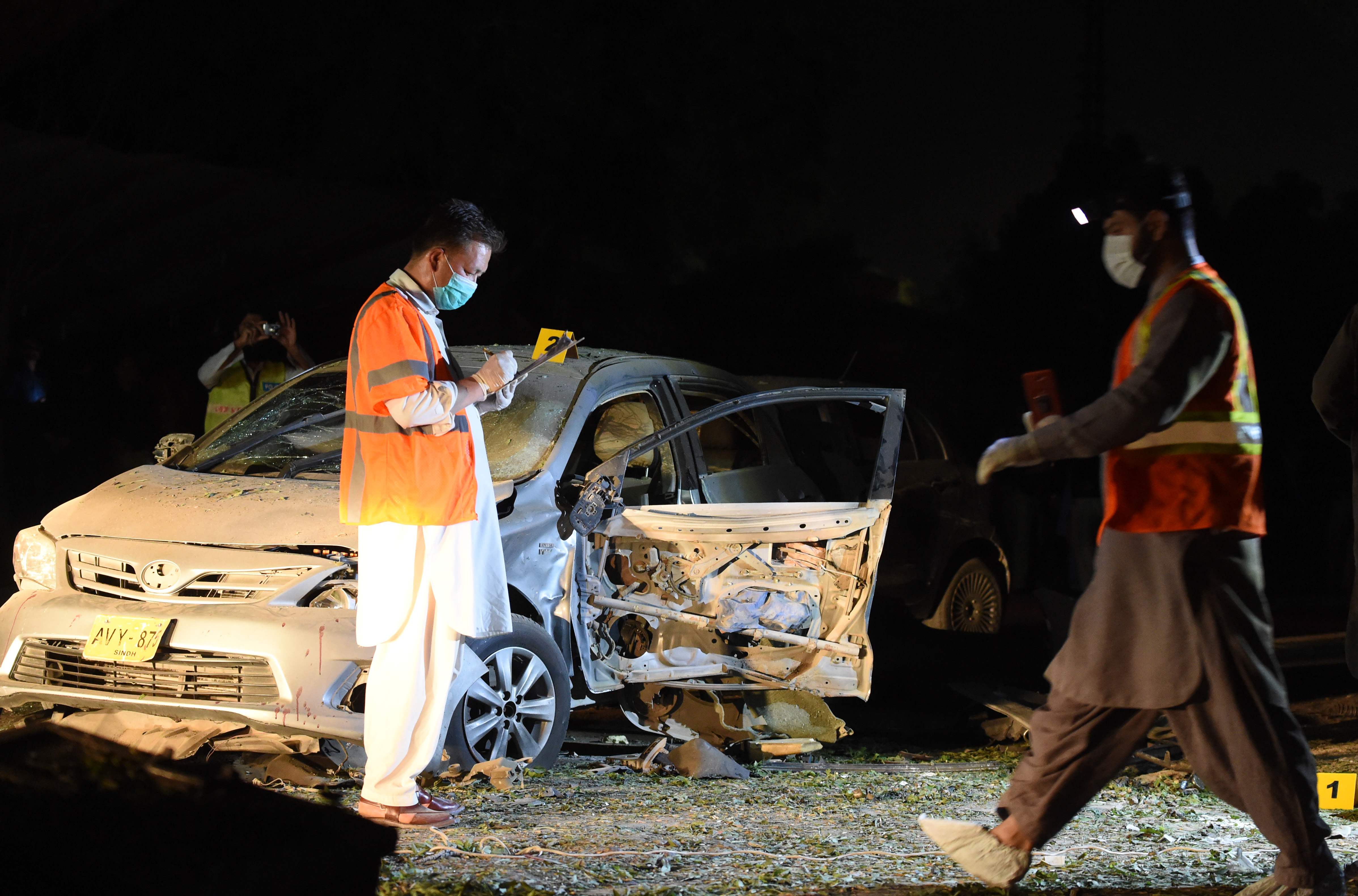 Pakistani security officials examine the site of a bomb blast in Quetta on May 13, 2019. Security forces acted after a sudden surge in militant assaults across Pakistan during the Muslim holy month of Ramadan, killing nine Daesh militants in Balochistan on Thursday. (AFP)