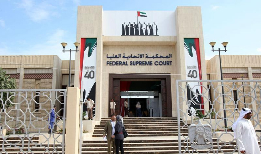 People stand outside the federal supreme court in Abu Dhabi, November 27, 2011. Pakistan said on Thursday that the United Arab Emirates had decided to free 572 Pakistani prisoners in its jails. (REUTERS/File)