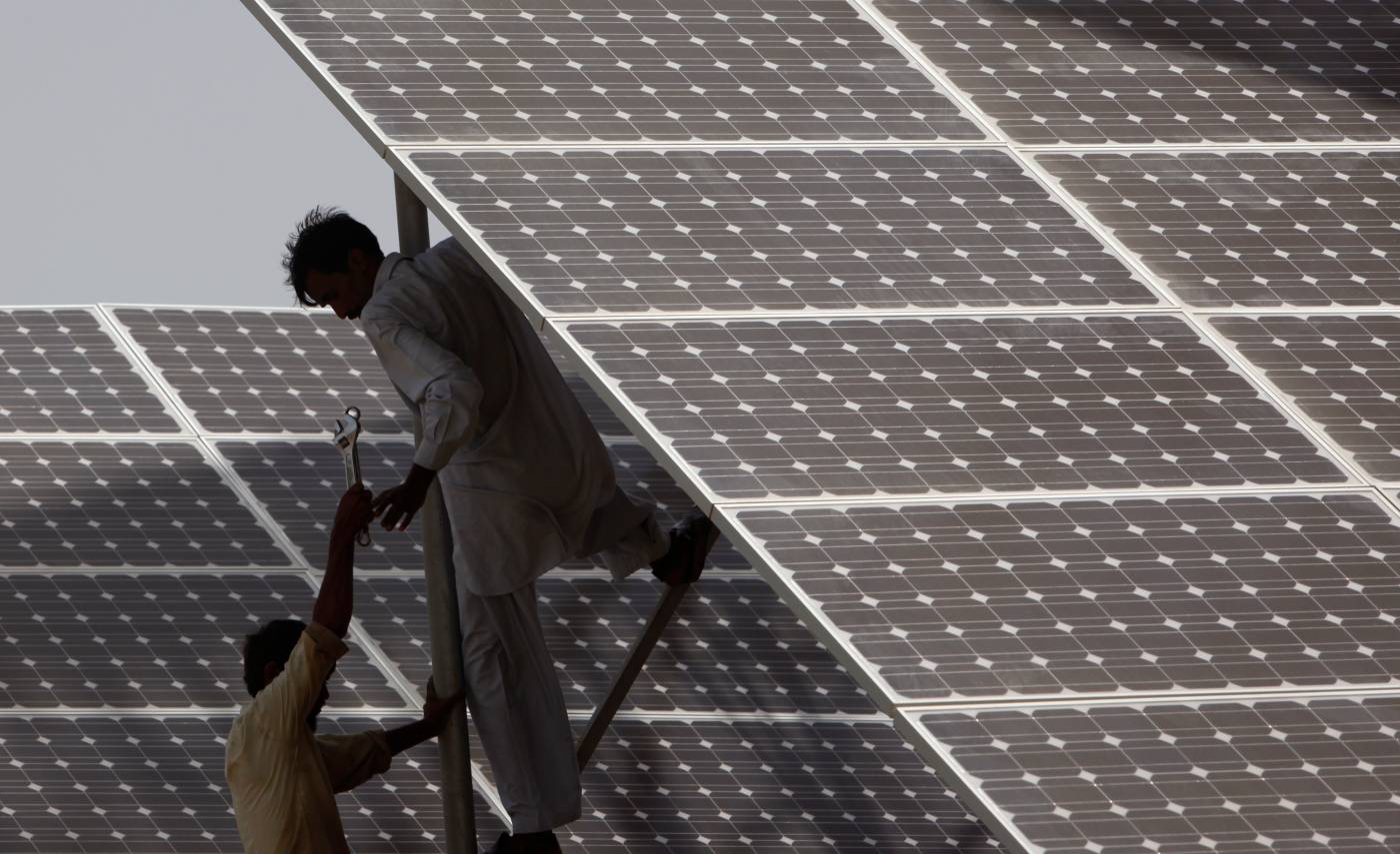 A worker at a solar power plant. Saudi Arabia’s ACWA Power is planning a number of solar and wind power facilities in Pakistan. (Reuters/File)