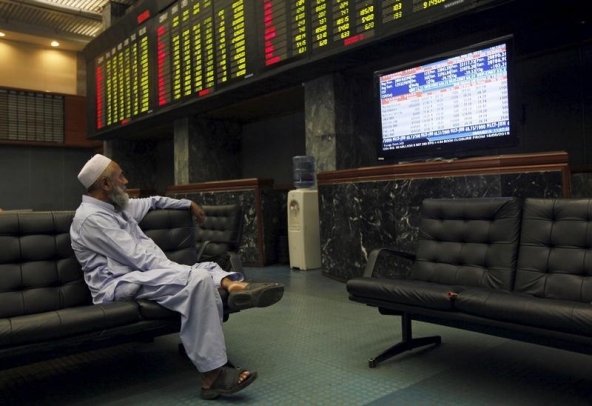 In this file photo a man monitors stock prices during a trading session in the halls of Karachi Stock Exchange, Pakistan, May 28, 2015. (REUTERS/File)