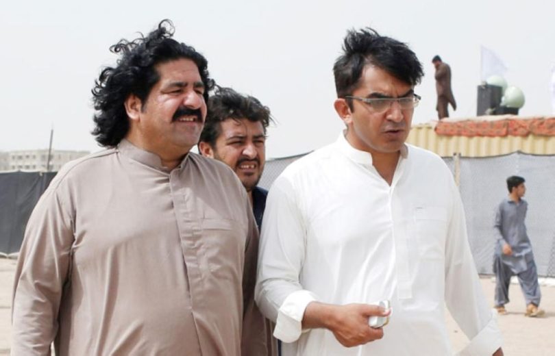 In this May 13, 2018 file photo, Ali Wazir (L) and Mohsin Dawar, leaders of the Pashtun Tahaffuz Movement (PTM), walk at the venue of a rally in Karachi, Pakistan. (Reuters)