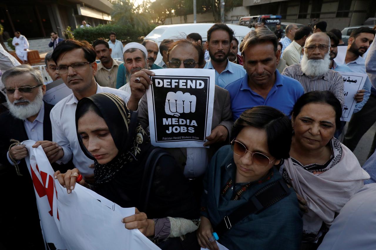 Journalists chant slogans during a rally protest which they say is against layoffs and the non-payment of salaries, in Karachi, Pakistan February 26, 2019. (REUTERS)