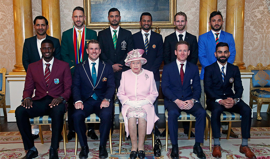 Britain's Queen Elizabeth II joins the captains of the teams taking part in the ICC Cricket World Cup for a photograph in the 1844 Room at Buckingham Palace, before a Royal Garden Party in London, Wednesday, May 29, 2019. Back row from left, Pakistan's Sarfaraz Ahmed, South Africa's Francois du Plessis, Bangladesh's Masrafe Bin Mortaza, Sri Lanka's Dimuth Karunaratne, New Zealand's Kane Williamson and Afghanistan's Gulbadin Naib. Front row from left, West Indies' Jason Holder, Australia's Aaron Finch, England's Eoin Morgan and India's Virat Kohli. (Yui Mok/Pool photo via AP)
