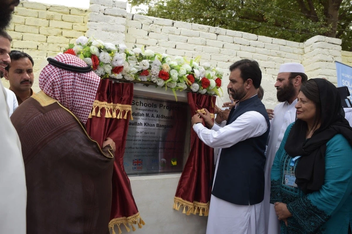 Advisor to KP Chief Minister on Education Ziaullah Bangash (right) and Eng. Abdullah Al Shoaibi, regional manager for Saudi Fund for Development (SFD), inaugurate installation of solar PV systems in Khyber Pakhtunkhwa (KP) province. (Photo courtesy: KP education directorate)