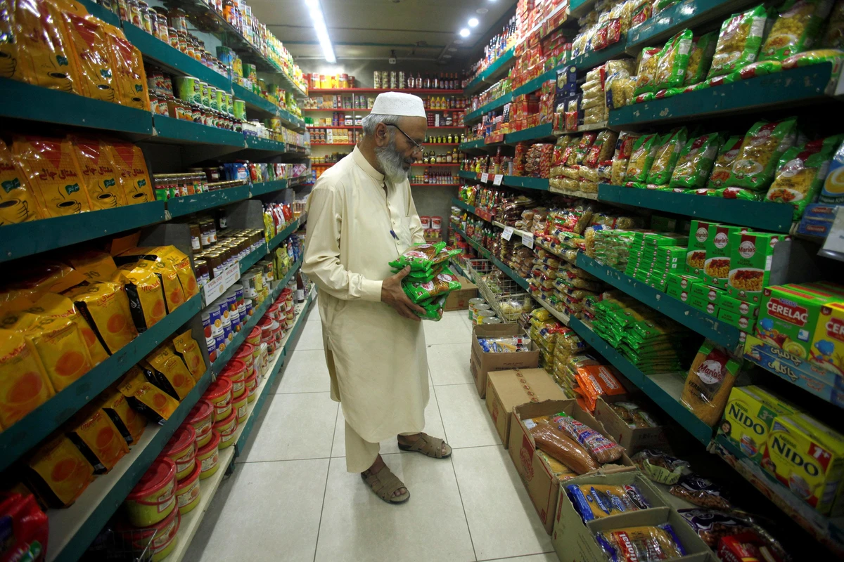 In this April 27, 2018 file photo, a man shops for grocery items at a store in Peshawar. Pakistan’s economic growth is likely to hit an eight-year low, a government report predicted on Friday, as the country continues to negotiate a bailout with the International Monetary Fund. (Reuters)