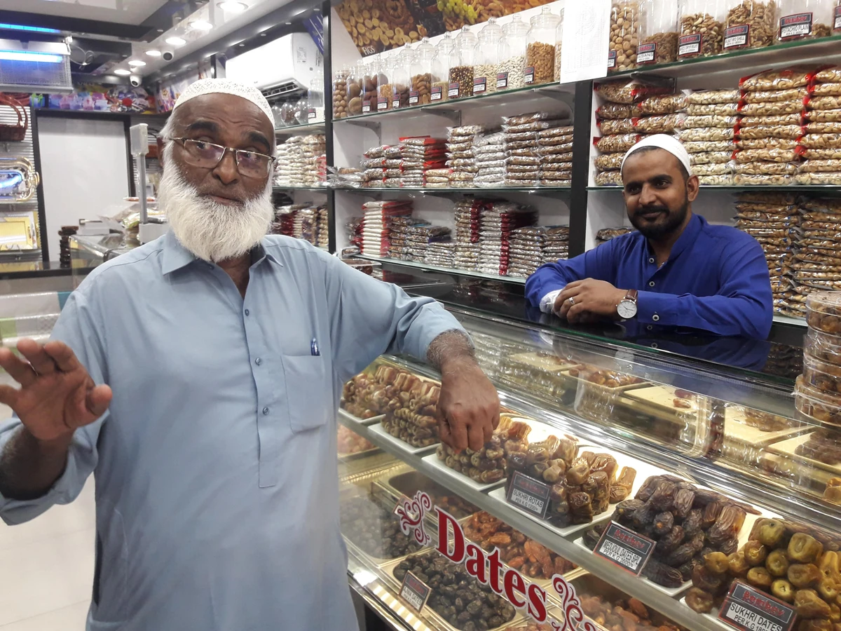 Hajji Abubaker, an importer of Saudi dates, talks about the varieties of the Kingdom’s dates at his shop in Pakistan’s Karachi city on May 8, 2019. (Photo Khurshid Ahmed)