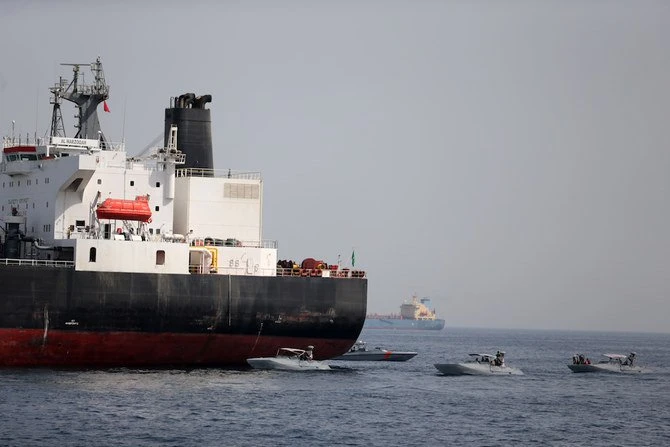 UAE Navy boats are seen next to Al Marzoqah, Saudi Arabian tanker, off the Port of Fujairah. (Reuters)