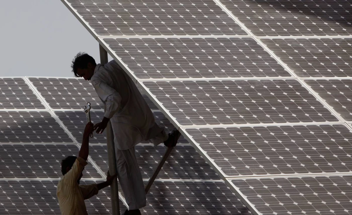 A worker at a solar power plant. Saudi Arabia’s ACWA Power is planning a number of solar and wind power facilities in Pakistan. (Reuters/File)