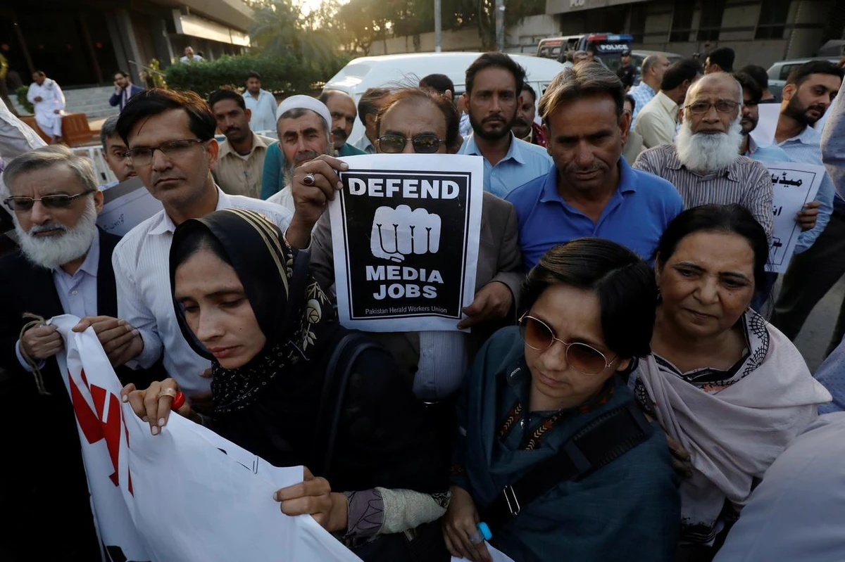 Journalists chant slogans during a rally protest which they say is against layoffs and the non-payment of salaries, in Karachi, Pakistan February 26, 2019. (REUTERS)