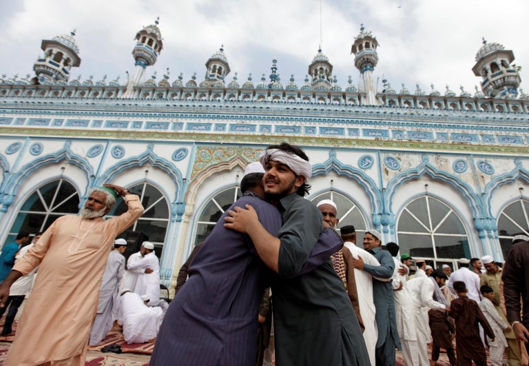In this file photo people exchange greetings after offering Eid prayers in one of the mosques in Pakistan. The government of northwestern Khyber Pakhtunkhwa (KP) province has announced to observe Eid Al-Fitr today (Tuesday), leading the country to celebrate two Eids. The central government has announced to observe Eid on Wednesday. ( Reuters/File)