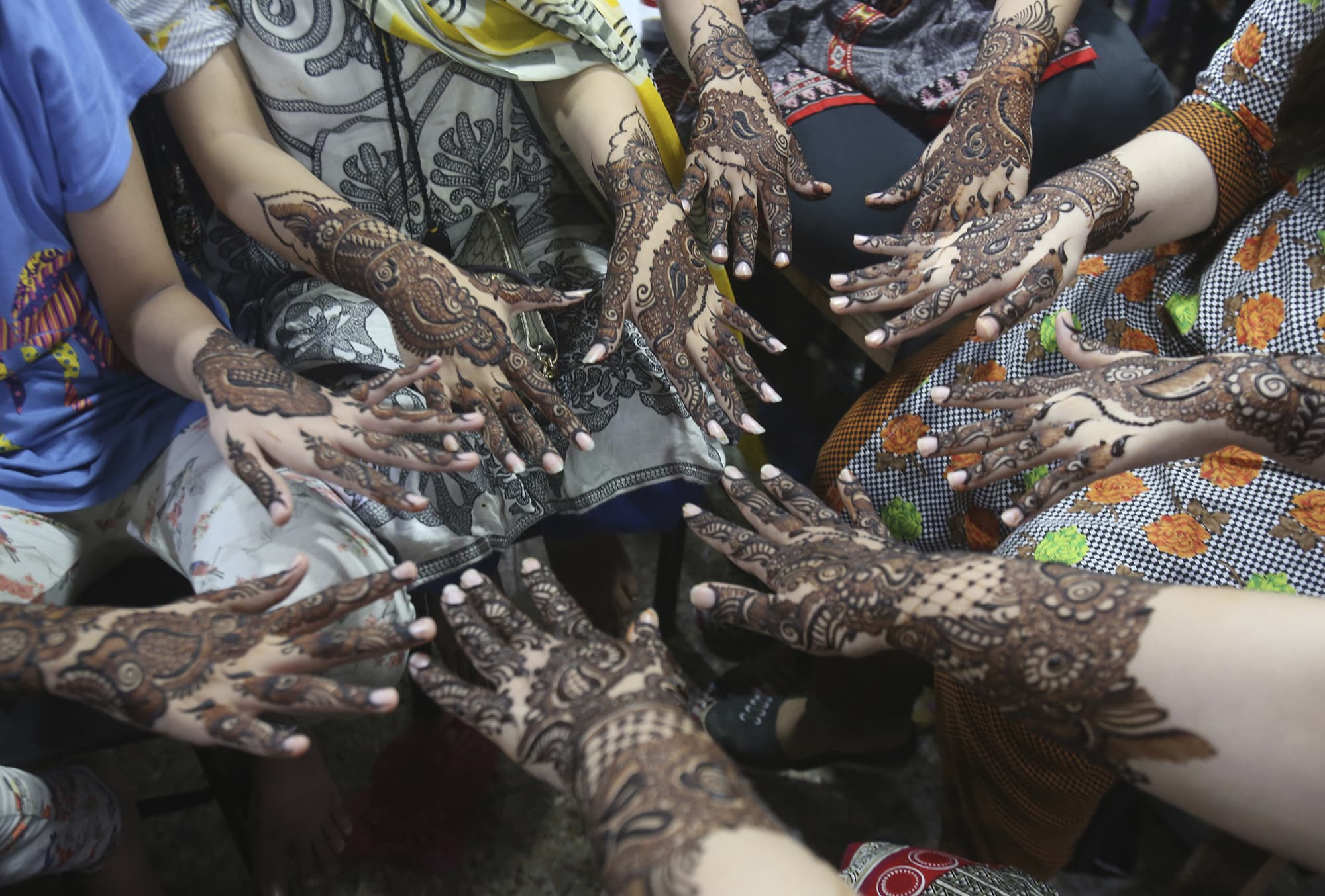 Girls show their hands painted with henna to celebrate Eid al-Fitr on Tuesday, 05 June 2019. — AP