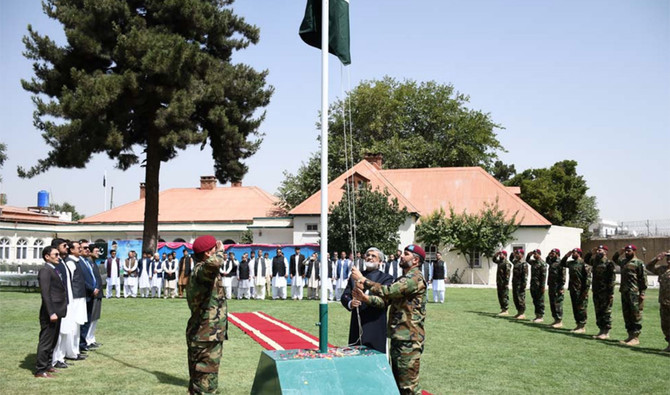 In this March 23, 2016 file photo, Pakistan’s ambassador Syed Ibrar Hussain can be seen hoisting his country’s national flag at the embassy in Kabul. Pakistan’s diplomatic mission in Afghanistan has requested for more facilities to entertain growing number of people who want to visit Pakistan. (Courtesy Embassy of Pakistan in Kabul)