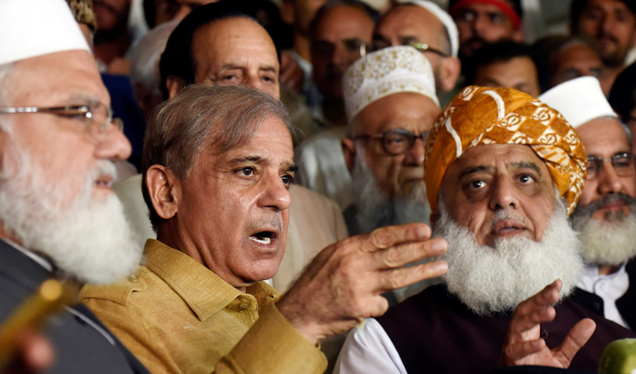 Shehbaz Sharif, second from left, the PML-N president and brother of Nawaz Sharif, speaks during a news conference as Fazal ur Rehm Jamiat Ulma-e-Islam party leader looks on after an All Parties Conference in Islamabad on July 27, 2018. (Reuters/File)