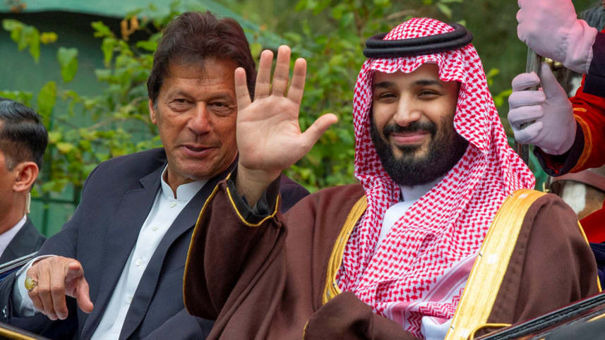 Pakistan’s Prime Minister Imran Khan and Saudi Crown Prince Mohammed Bin Salman riding in a carriage during a welcome ceremony in Islamabad on February 18, 2019. (AFP)