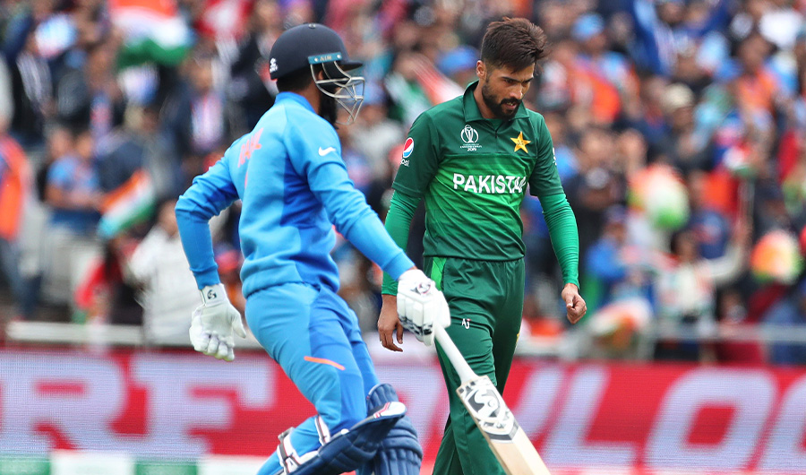 Pakistan's Mohammad Amir, right, reacts after India's K.L. Rahul, left, hit a boundary on his delivery during the Cricket World Cup match between India and Pakistan at Old Trafford in Manchester, England, Sunday, June 16, 2019. (AP)