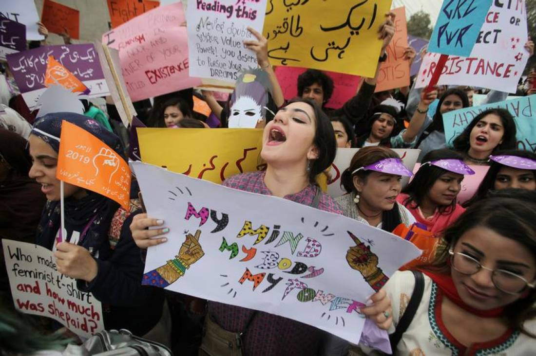 A woman carries a sign and chants slogans during a rally to mark International Women's Day in Lahore, Pakistan March 8, 2019. (REUTERS)
